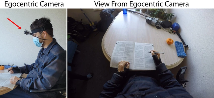 A man wearing a head-mounted egocentric camera, with a side panel showing the first-person view captured as he writes
