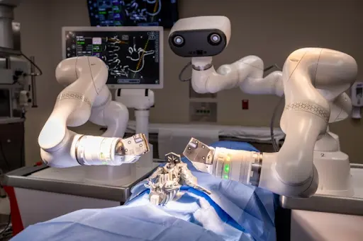 A dual-arm surgical robot performing a precise medical procedure on a patient in a modern operating room
