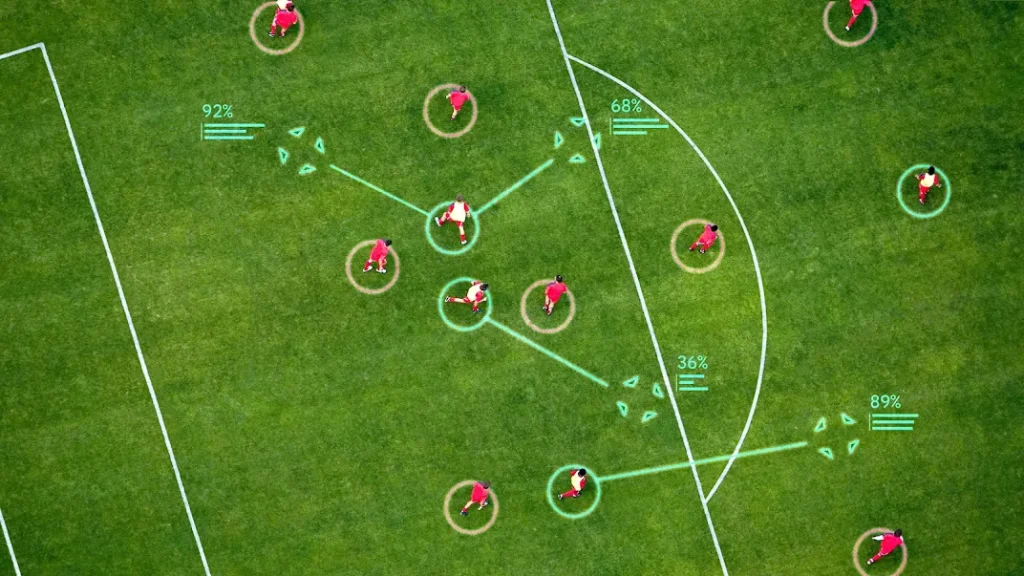 Overhead view of a soccer match with AI overlays tracking players, showing potential passes and analytics on the field