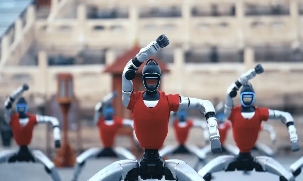 Group of humanoid robots in red shirts executing synchronized martial arts stances during a demonstration